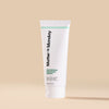 Tube of 'Matter of Monday' cleanser on a beige background