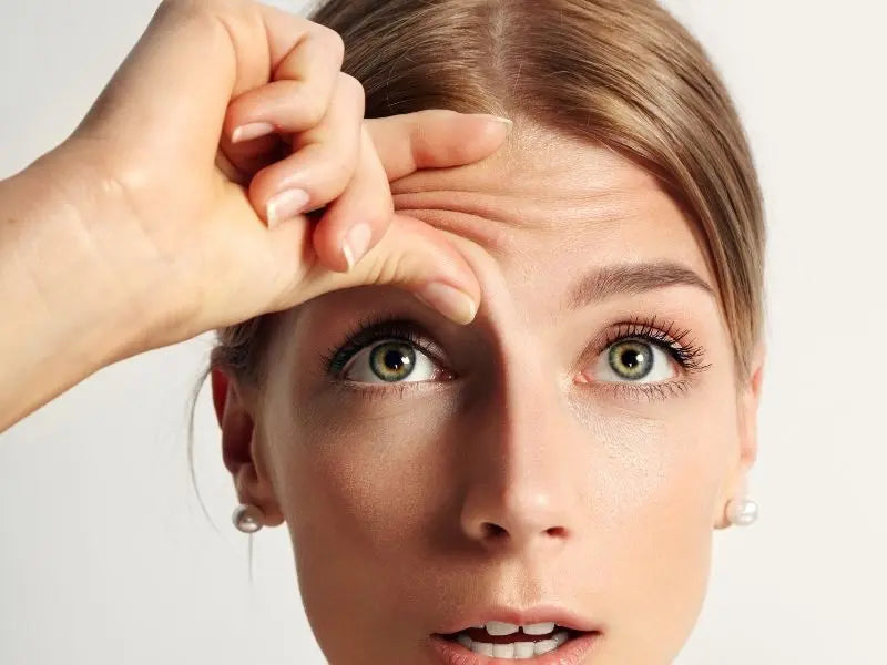 Cover image showcasing a woman holding her wrinkled skin