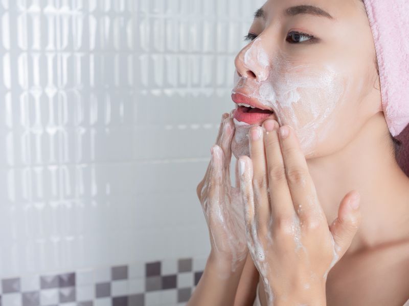 Woman washing face