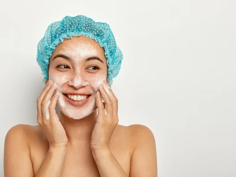 Woman using a facial cleanser