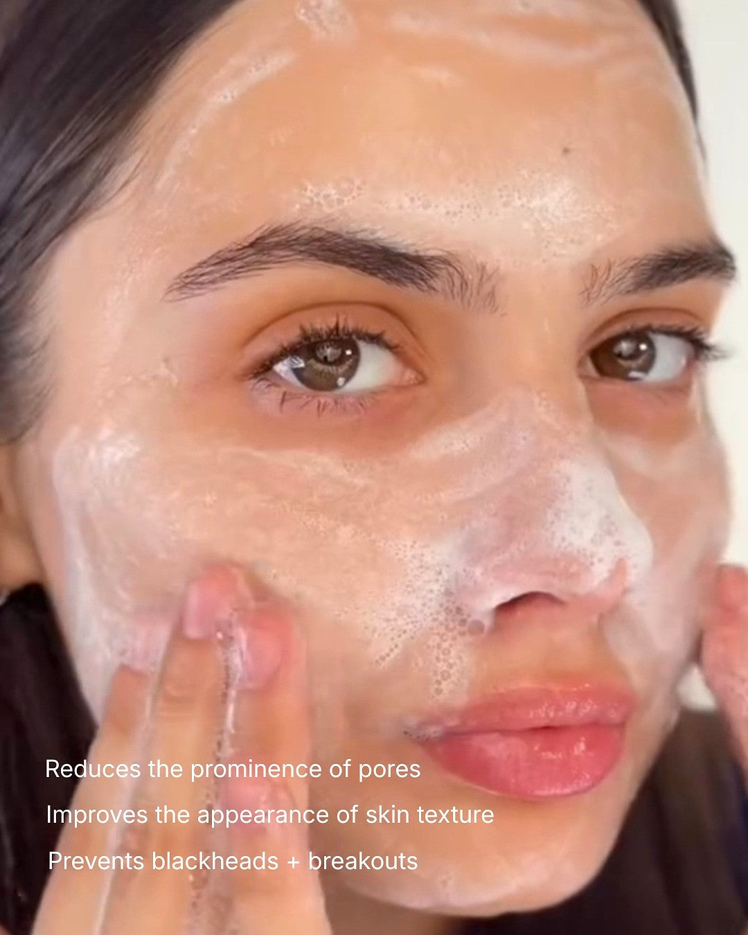 Person applying a facial mask with text highlighting benefits