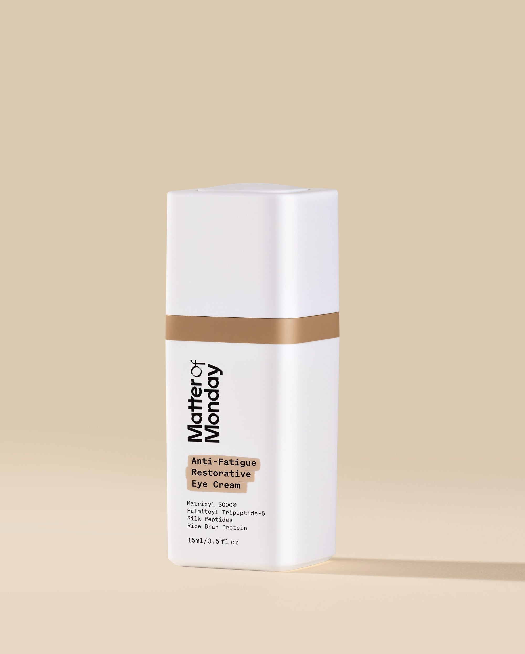 White skincare bottle with brown label on a beige background