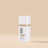 Skincare bottle with 'Monday' branding on a beige background