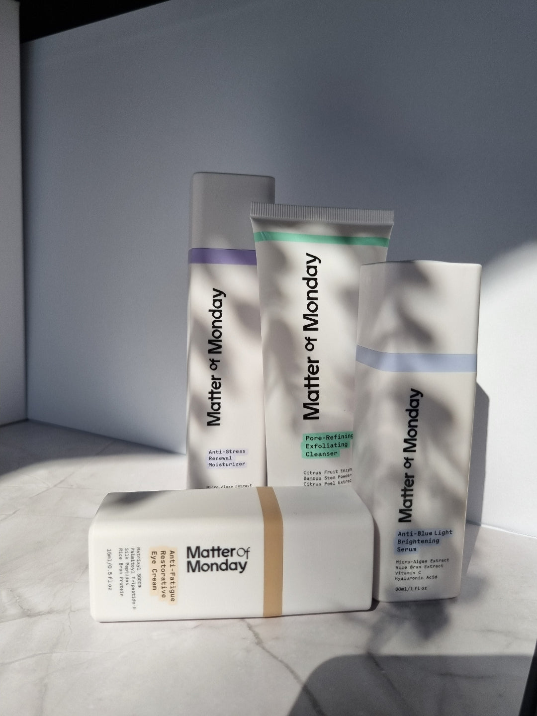 Matter of Monday skincare products on a gray surface with a neutral background