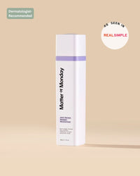 White skincare bottle with purple label on a beige background, featuring 'Dermatologist Recommended' and 'Real Simple' logos.