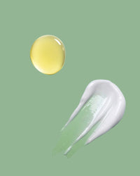 Yellow droplet and white smear on a green background